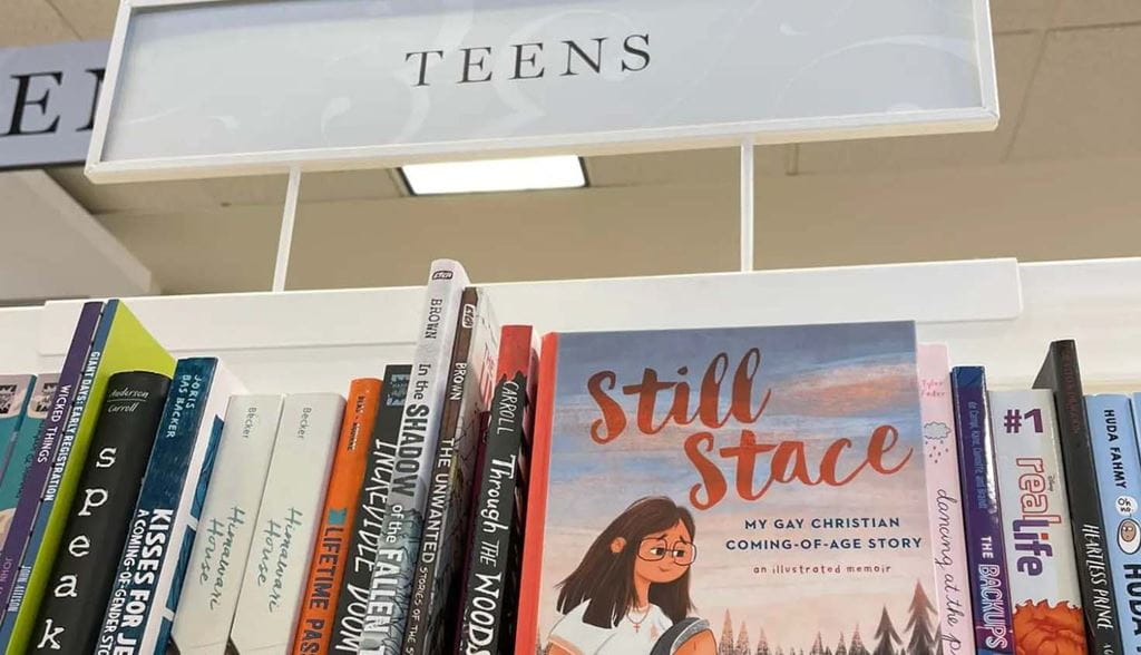A copy of Stacey Chomiak's memoir, 'Still Stace' sitting on a bookshelf in the TEENS section of the bookstore.