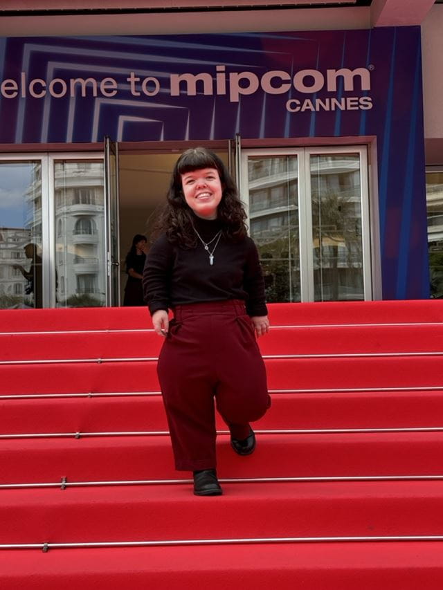 Violet Ferguson is pictured standing on the stairs outside the Mipcom trade show in Cannes, France