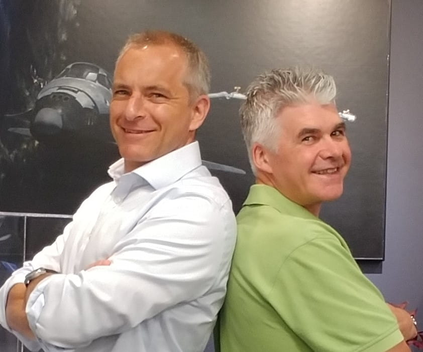 Canadian astronaut David Saint-Jacques stands back to back with osteopathic manual practitioner René Pelletier