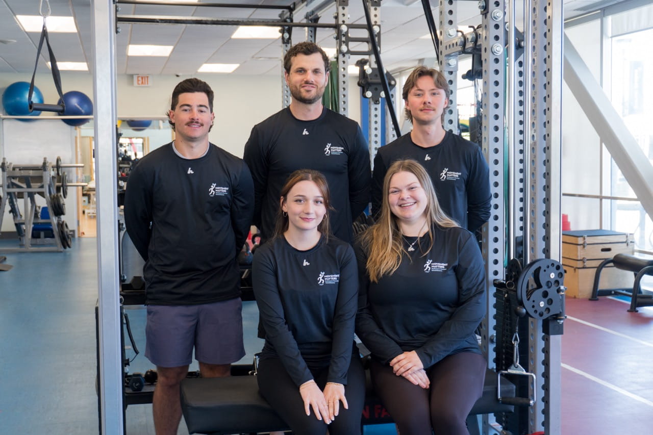 Staff and student therapists from Sheridan's Movement Matters clinic are pictured in a gym environment