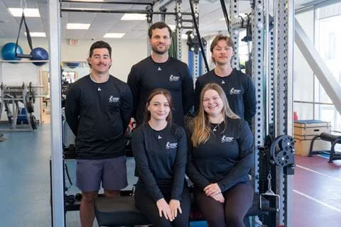 Staff and student therapists from Sheridan's Movement Matters clinic are pictured in a gym environment