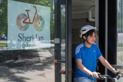 David Arango with a bike from the Sheridan Bike Hub