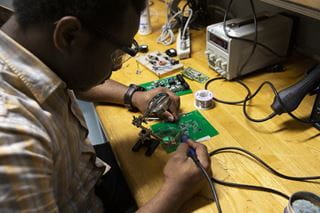 Electrical engineering student with circuit