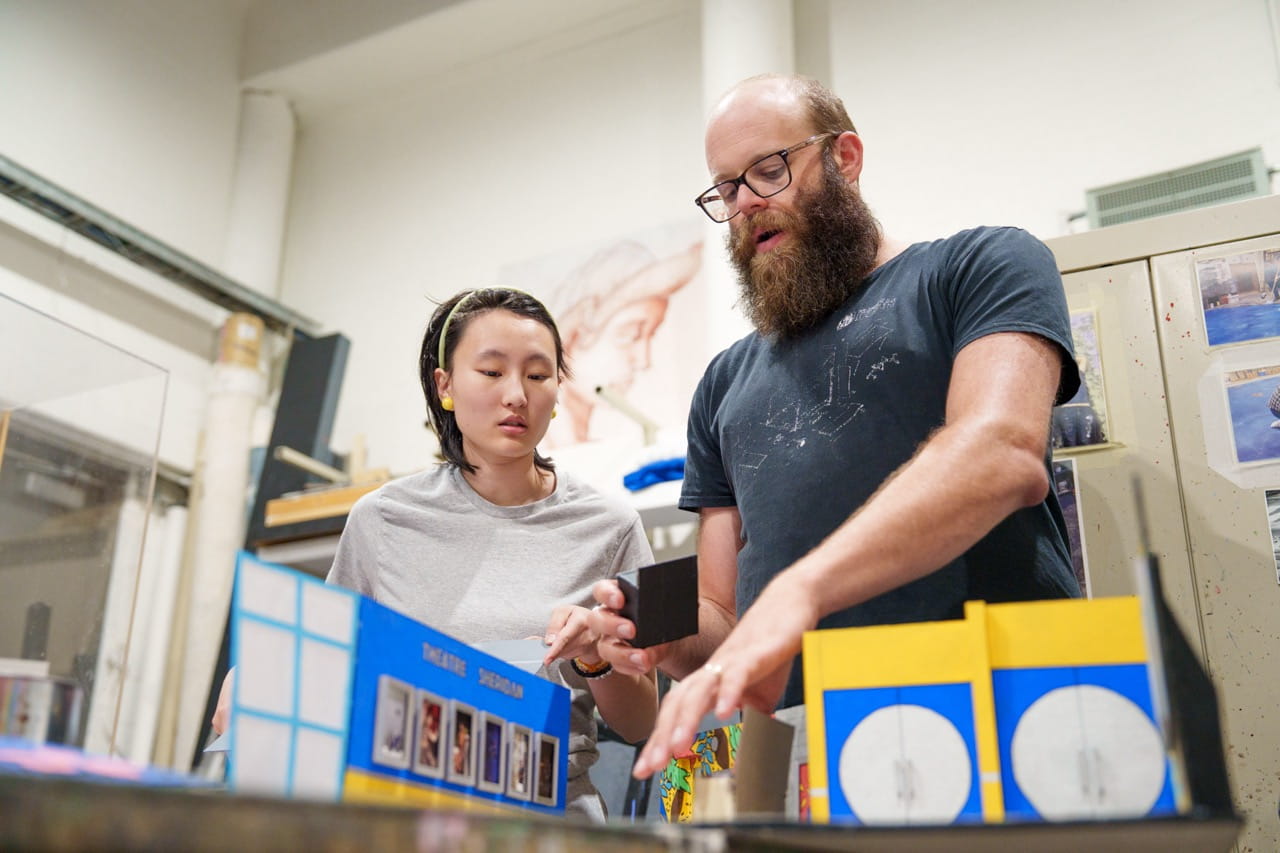 Theatre Sheridan production manager Jon Grosz provides instructions to a student in a workshop
