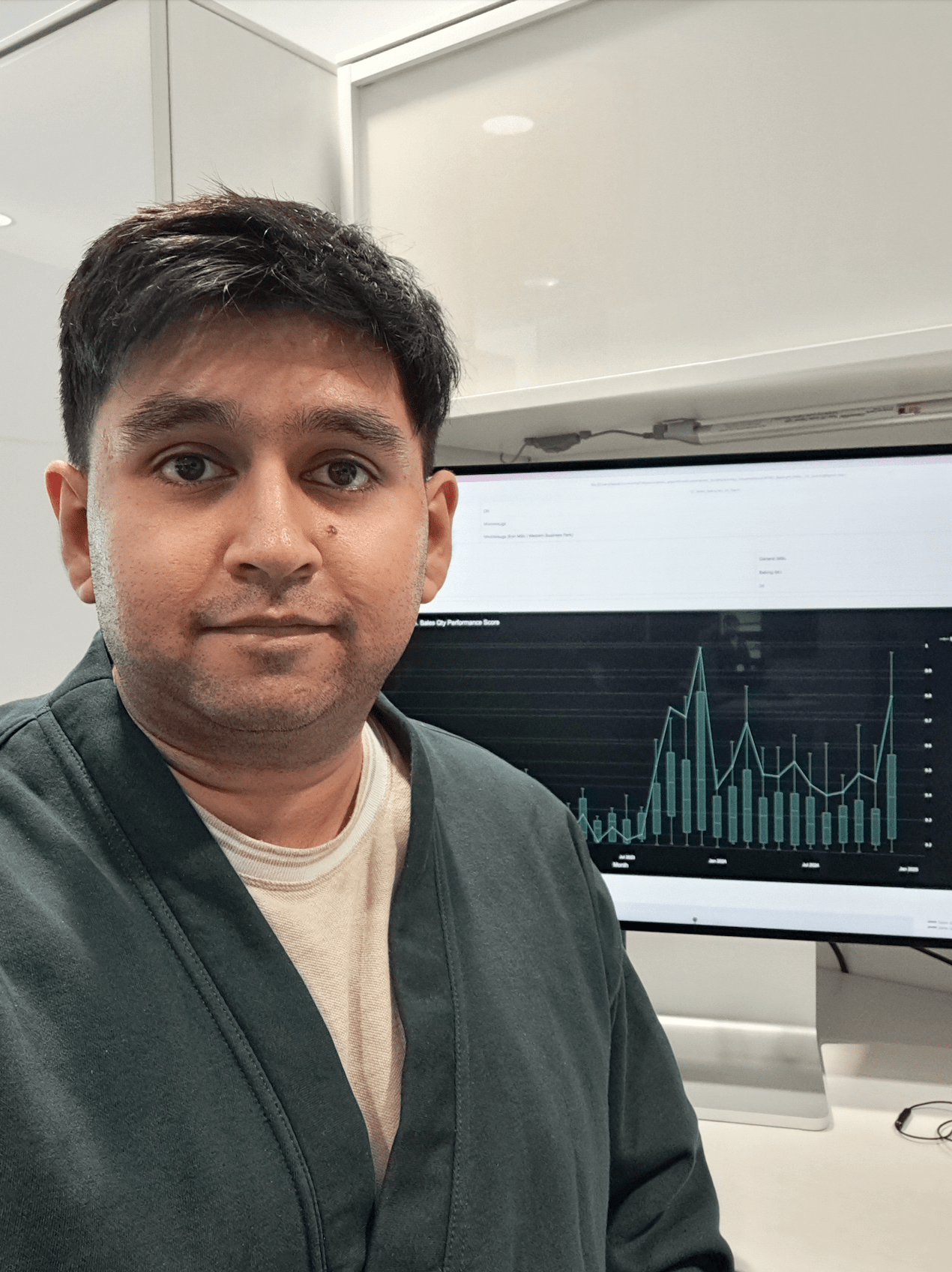 Computer Science student Tejas Kumar is pictured with a computer screen in the background