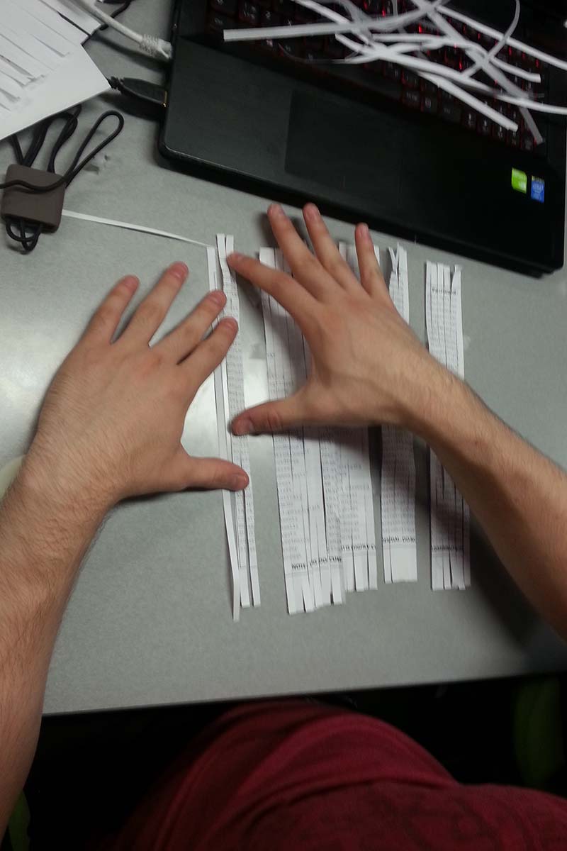 A student trying to piece together a shredded document