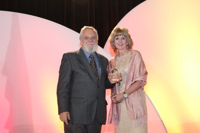 Dr. Victor Ralevich accepting the Canadian Community Colleges’ Gold Program Excellence Award