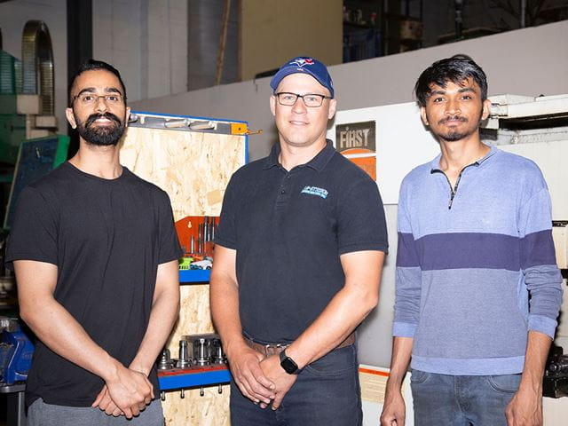 Kris Girdauskas (centre) with Sheridan graduates Amanpreet Singh (left) and Dhruvil Patel (right) at Re-Strike.