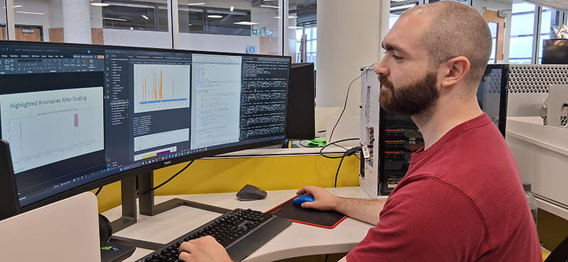 Sheridan computer science student Kyle Galway sits at a desk as he works on a program