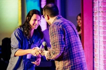 Nathan Powless-Lynes accepting the Ubisoft NEXT award