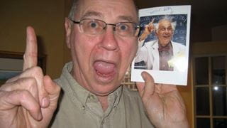 Passionate teacher smiling with finger up