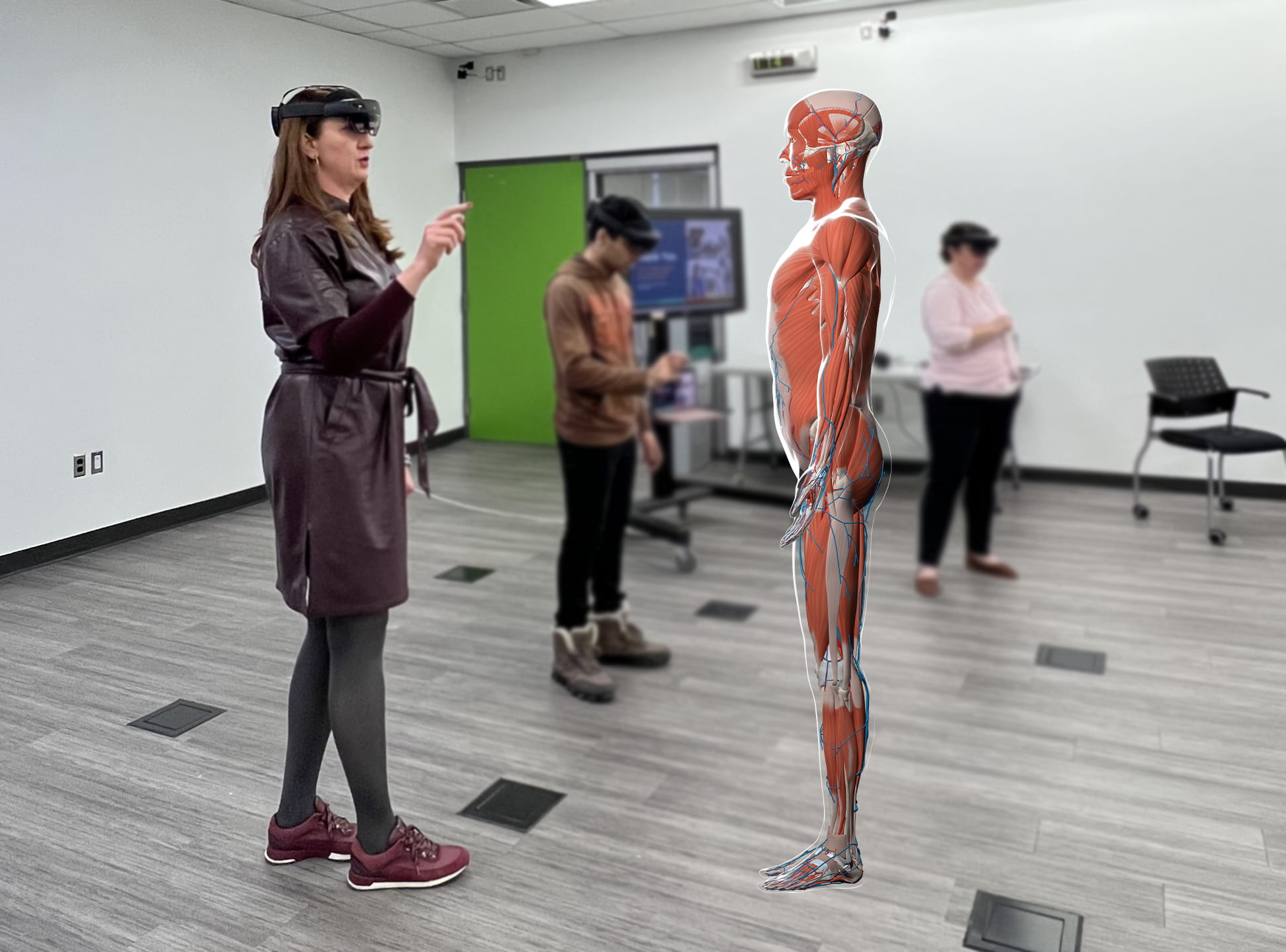 A Sheridan administrator uses the HoloAnatomy 3D mixed reality software to view a holographic imagery of a body.