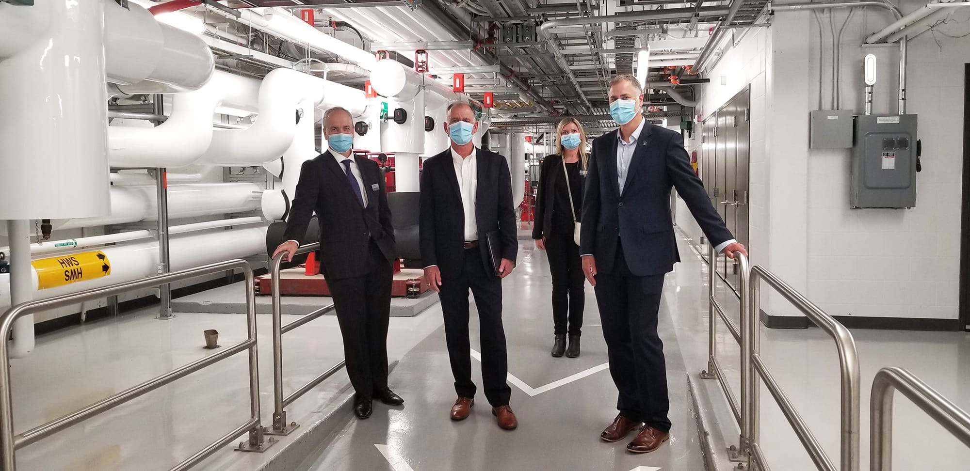 Representatives from Sheridan and Danfoss at Sheridan's District Energy Centre at the Trafalgar Campus in Oakville. 