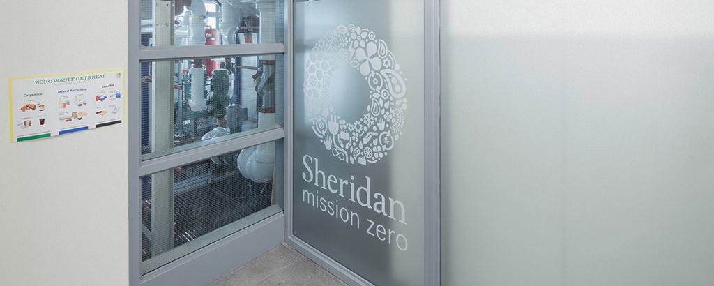 Transparent wall with a Sheridan mission zero decal in white on it