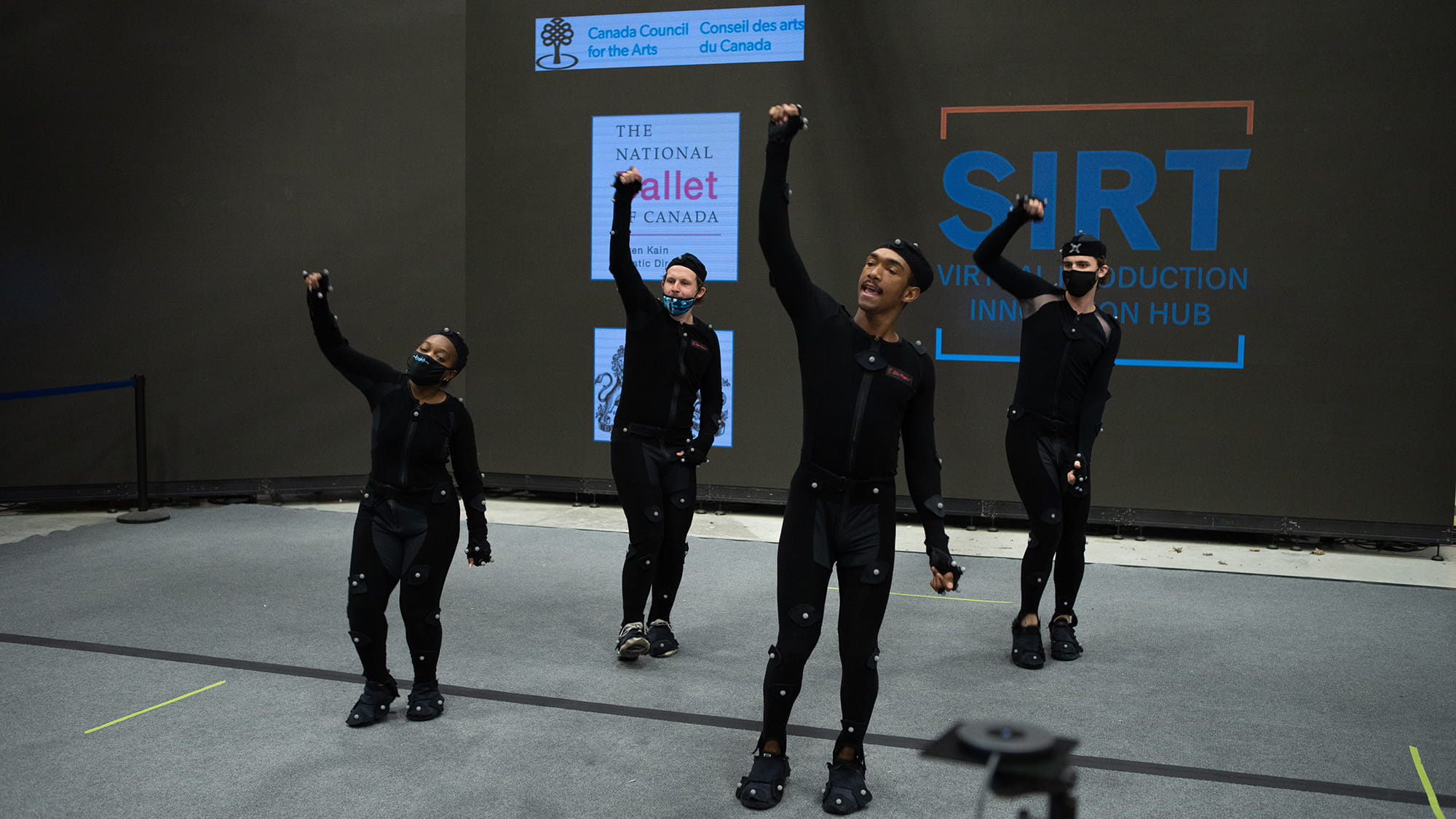Four actors in motion capture suits