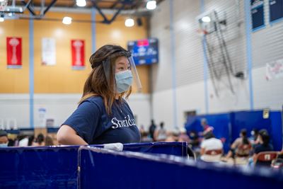 Sheridan volunteer at the vaccination clinic