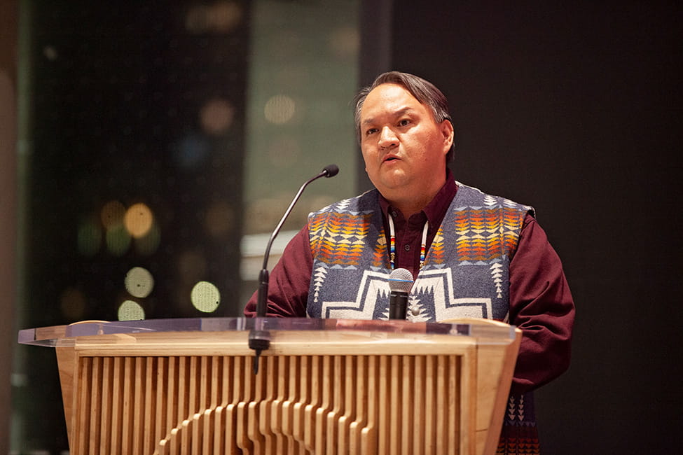 Person speaking at a podium