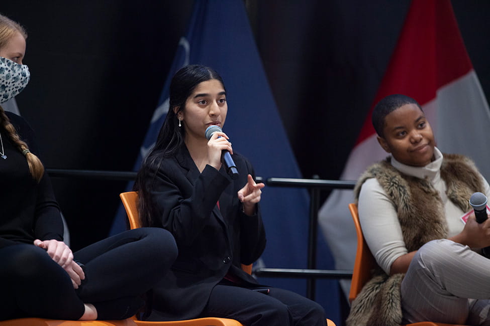 Person speaking into a microphone