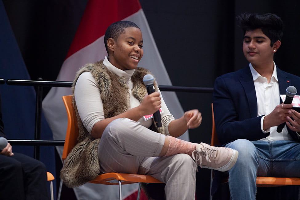 Person speaking into a microphone