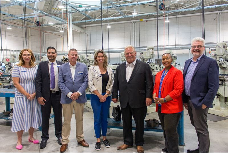 From left to right, Lindsay Engel, Dean of FAST; Rajan Sandhu, Vice President, Strategic Alignment & General Counsel, Office of the President; Greg Royal, Acting Associate Dean, Magna School for the Skilled Trades; Jill Dunlop, Minister of Colleges and Universities, Ontario Premier, Doug Ford; Charmaine Williams, Associate Minister of Women's Social and Economic Opportunity; and Ian Howcroft, Chief Executive Officer, Skills Ontario stand in a lab at Sheridan's Magna Skilled Trades Centre.