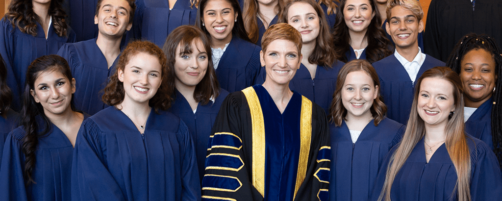 Dr. Janet Morrison with Sheridan students at the Sheridan graduation ceremony.