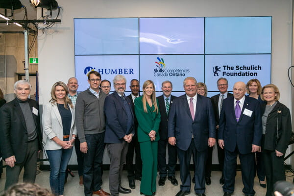 People standing together facing the camera at the Schulich Builders Scholarship announcement