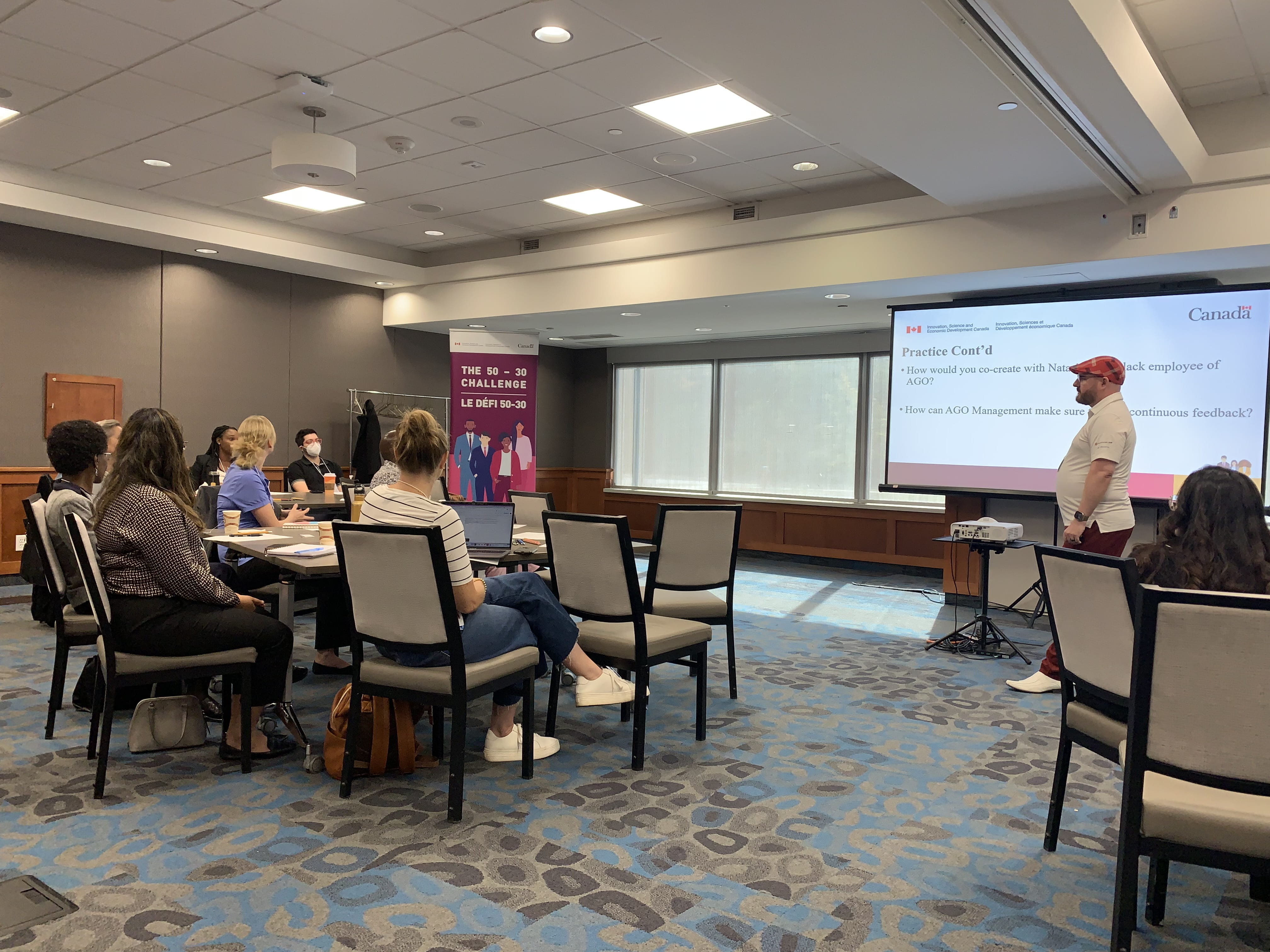 Wil Osbourne-Sorrell, Training Advisor of the 50 - 30 Challenge Hub at Fanshawe College, speaks during the 'Strengthen Your EDI - Core Course Day' event at Sheridan Conference Centre.