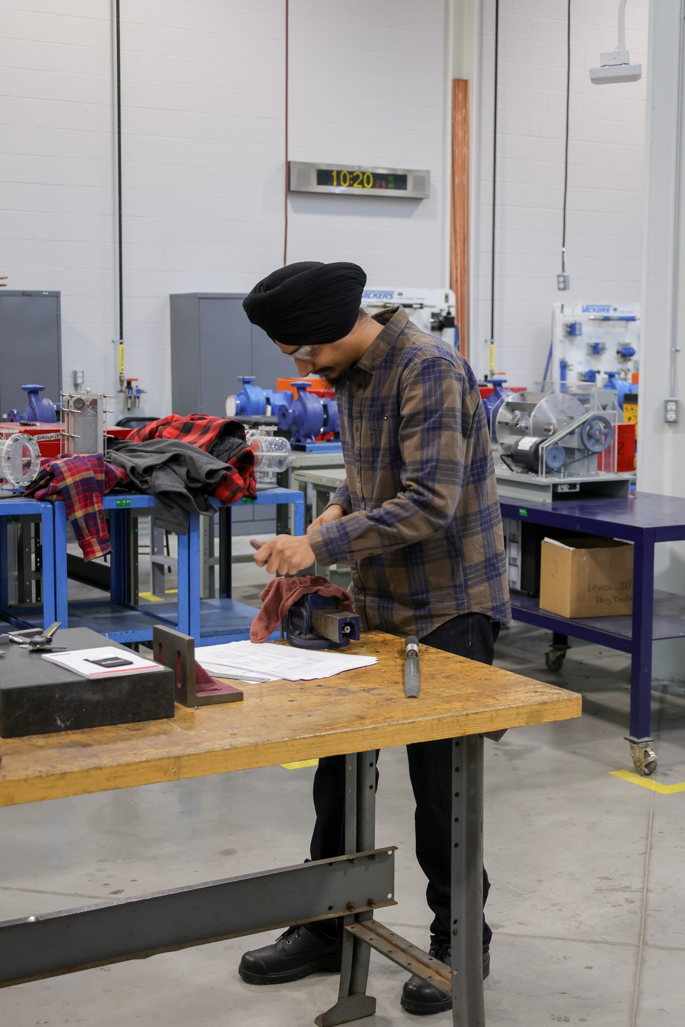A student uses a work bench while competing in the Skills Sheridan event