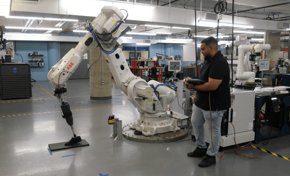 Research technologist Mohamed Kasim demonstrates the research activity of the robotic gait simulator inside Sheridan's Centre for Intelligent Manufacturing