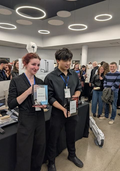 Hana Ambrozic and Bill Ma posing with their Rocket Awards.