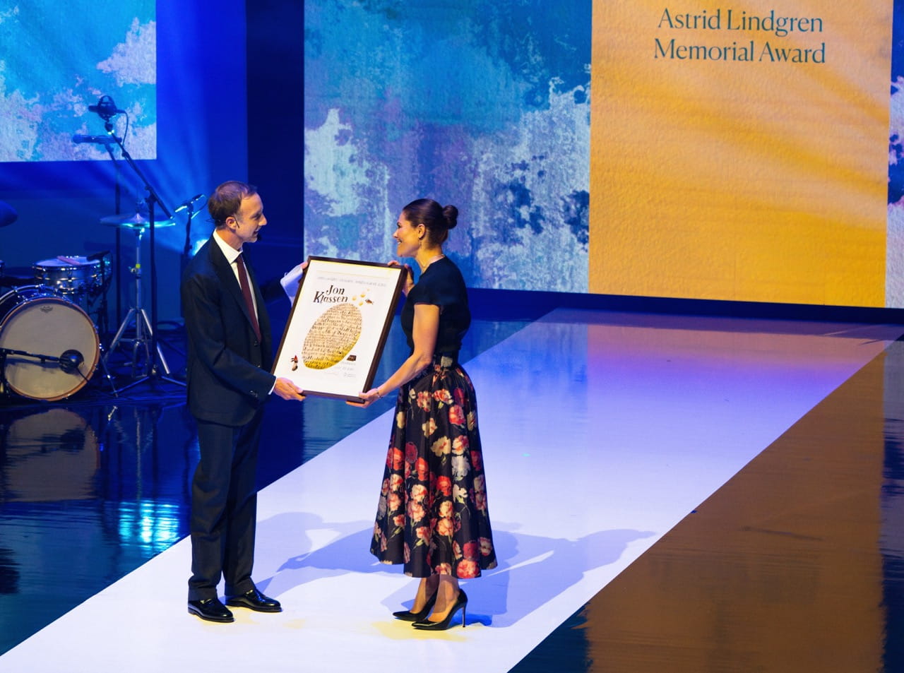 Jon Klassen is pictured on stage being presented with the Astrid Lindgren Memorial Award by Crown Princess Victoria of Sweden