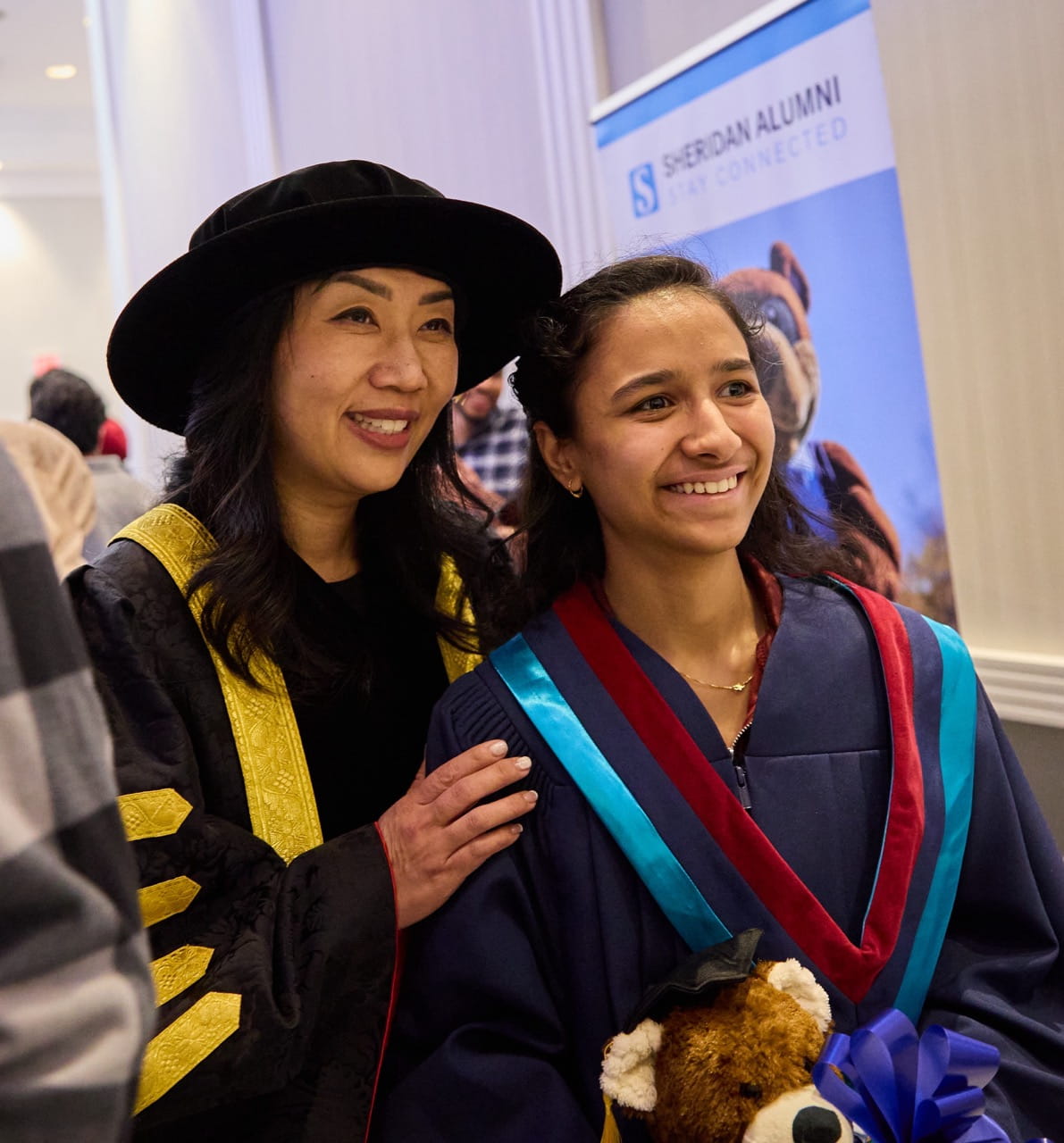 Sheridan President and Vice Chancellor Dr. Cindy Gouveia poses for a photo with a graduate