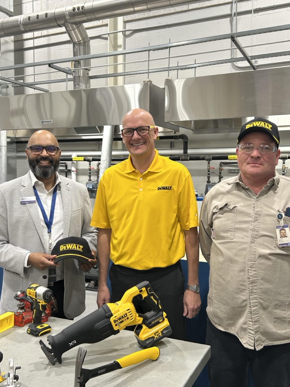 Sheridan Associate Dean Dev Baichan, DEWALT Field Sales Director Matt Beel and Sheridan welding instructor Richard Earle stand together for a group photo.