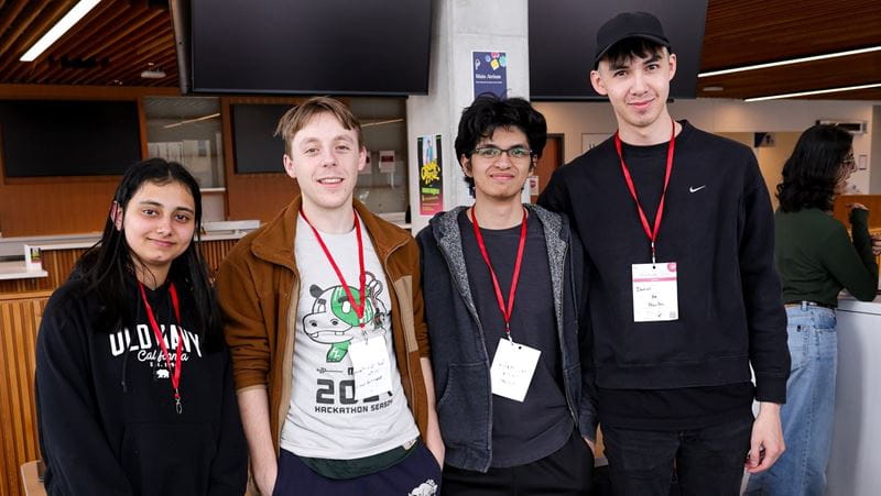 A group of four students who came in first place at Hackville