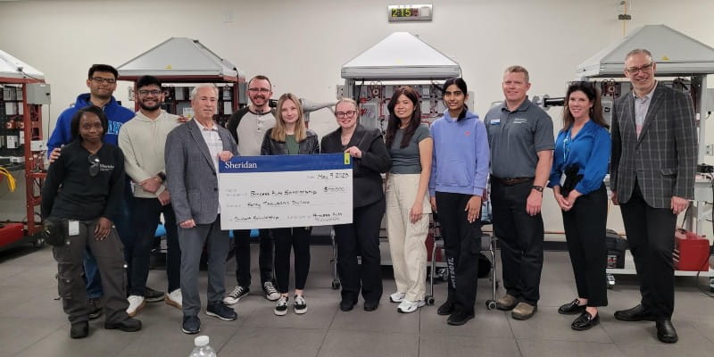 David Shnider, director of the Princess Auto Foundation, and the donation cheque.
