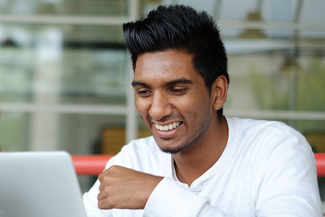 Student looking at a laptop screen