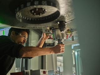 A student working with machinery