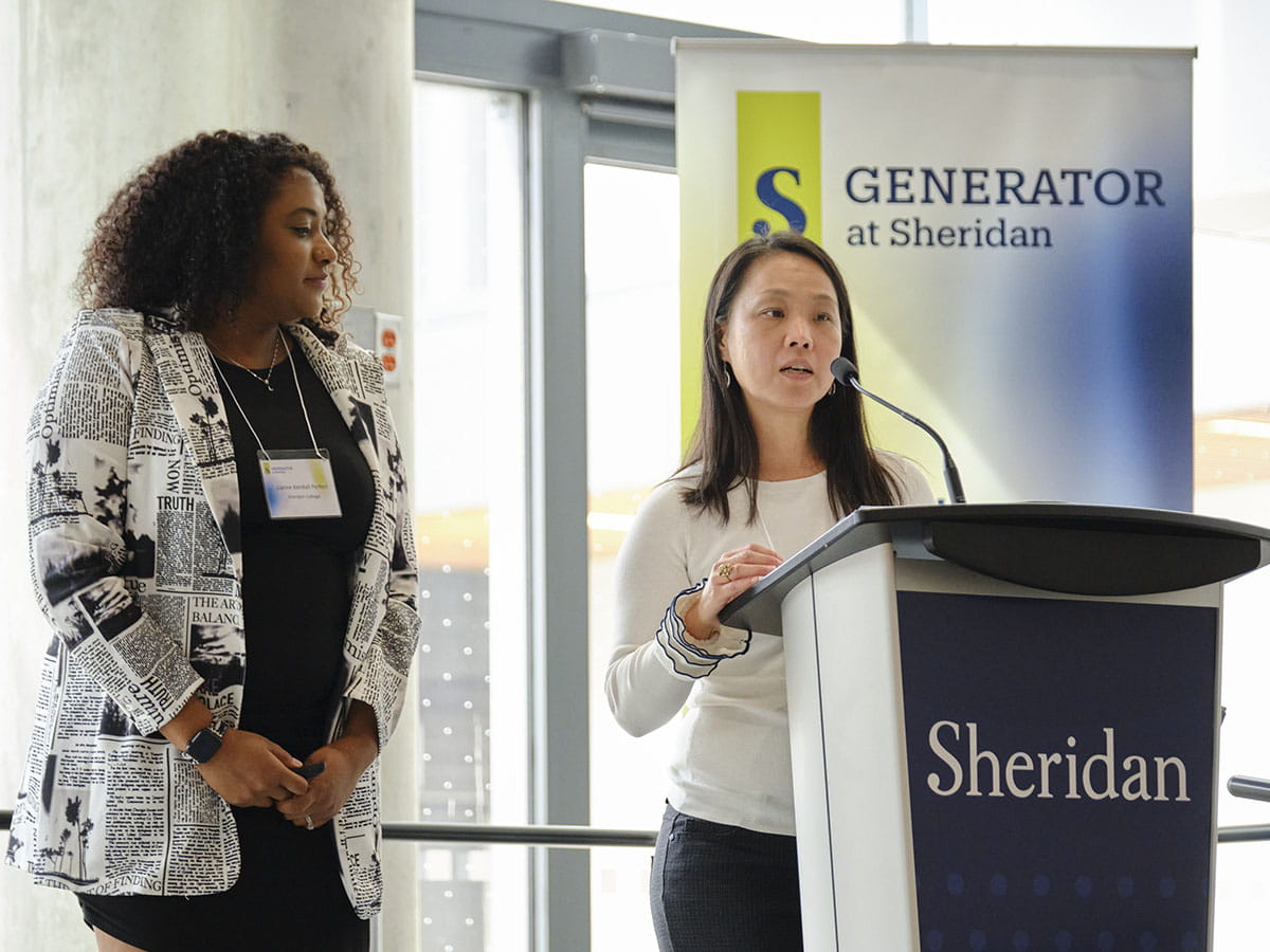 Two people standing at a podium