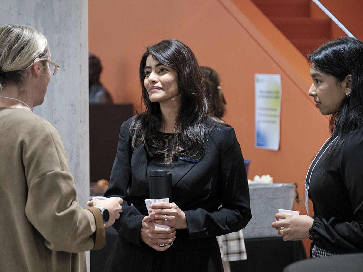 Three people having a discussion