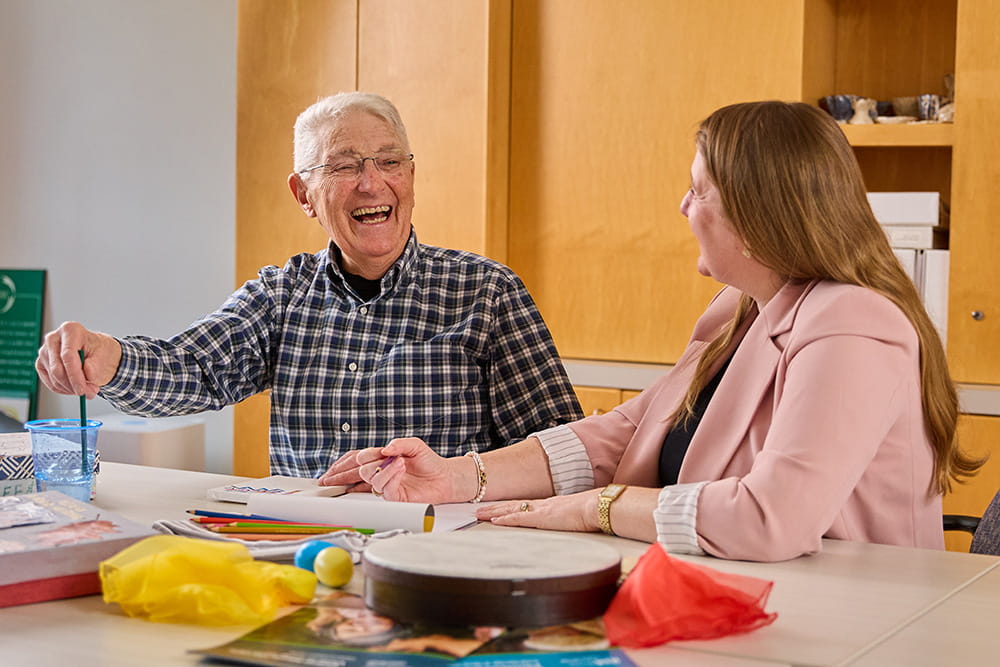 A man and woman laughing