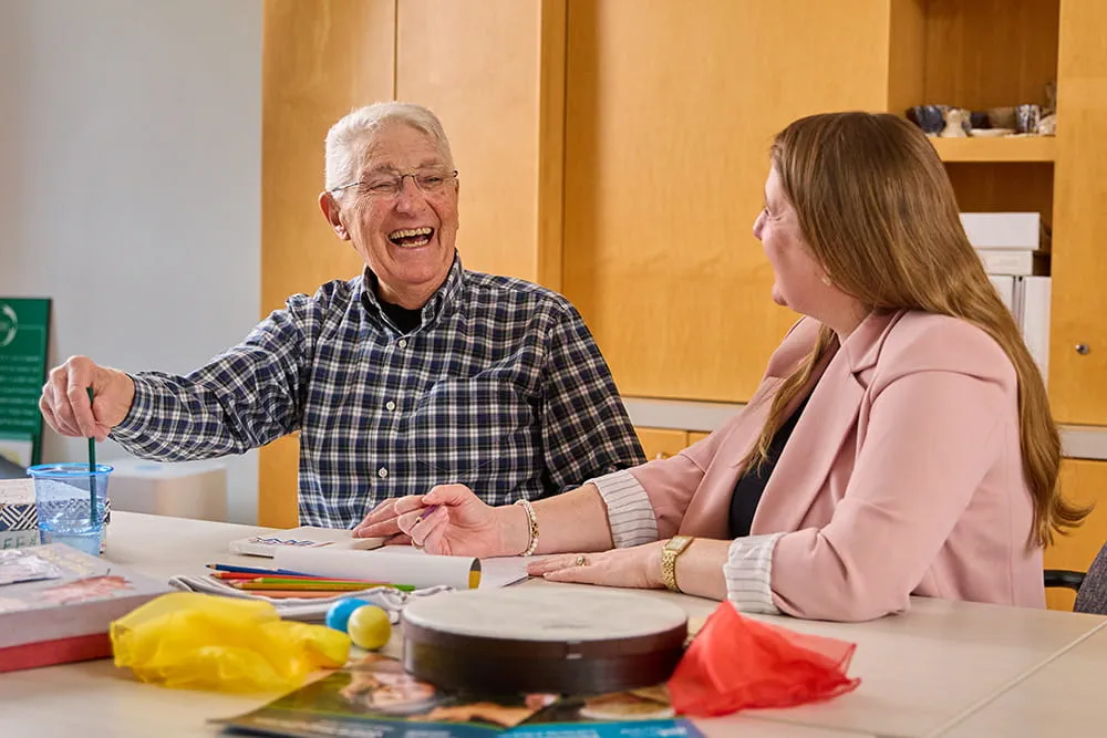 A man and woman laughing