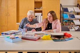 Two people painting