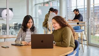 Students looking at a computer