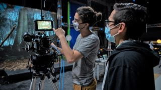 People working with video equipment in a studio