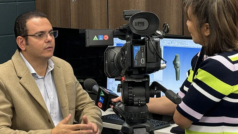 Person being interviewed on camera