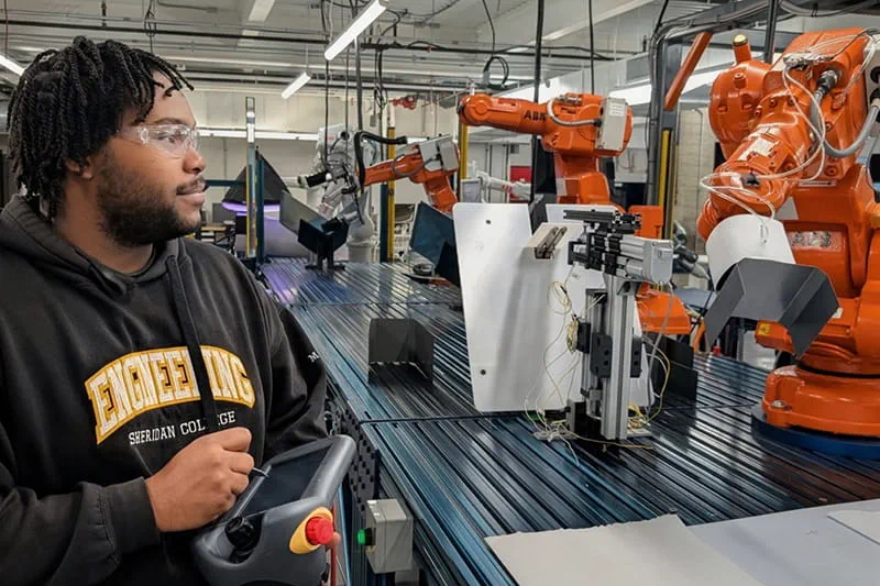 Person controlling a robotic arm