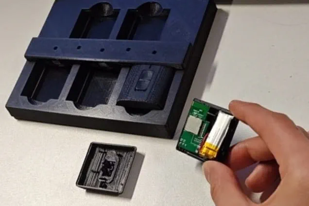 Hand holding a small computer chip