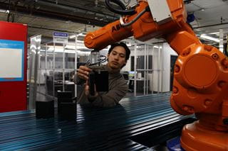 Person working on a robot