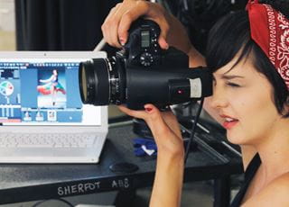 Photographer using a camera