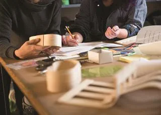 Industrial design students analyzing project